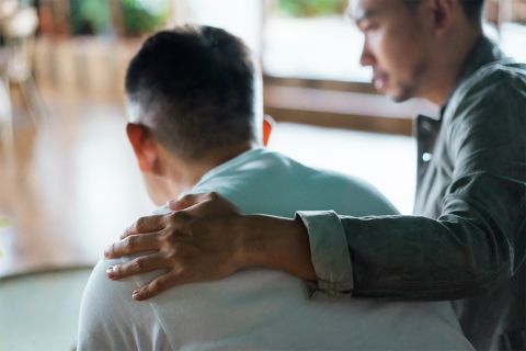 Photo of a man with his hand on the shoulder of another man to illustrate the article How to Confess Your Sins to One Another
